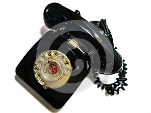 A vintage and antique telephone with white background. photo